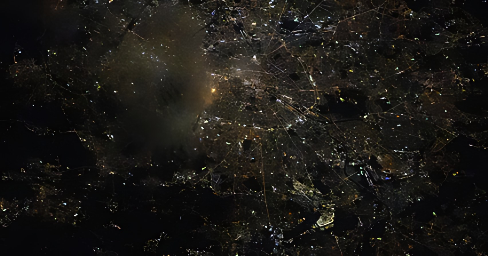 After Crisp: individual streetlights and roads resolve as distinct points and lines.
